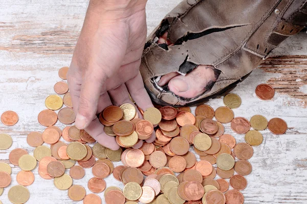 Poor and coins — Stock Photo, Image