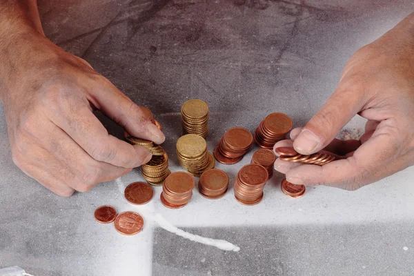Poor and coins — Stock Photo, Image