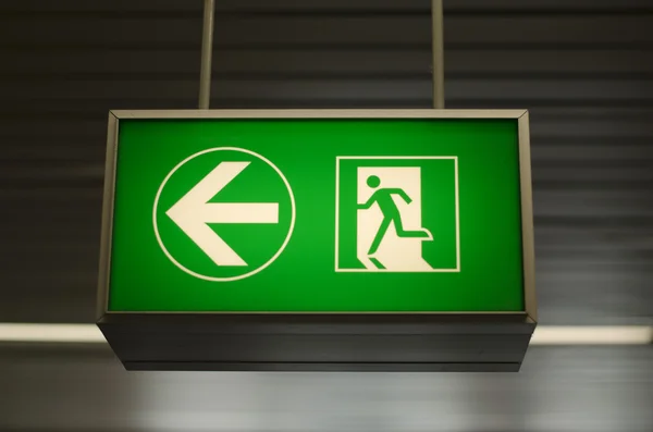 Green emergency exit sign — Stock Photo, Image