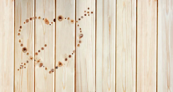 Heart made of knots on the board — Stock Photo, Image