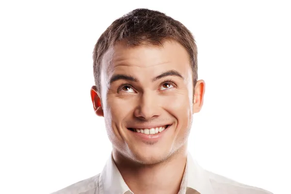 Handsome smiling young man looking up isolated — Stock Photo, Image