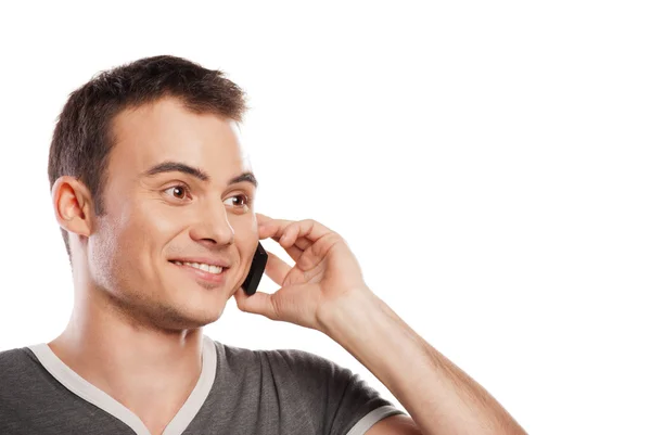 Happy man answering the phone isolated — Stock Photo, Image