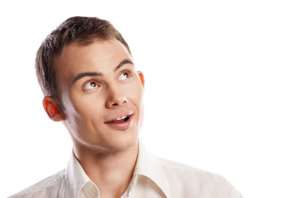 Handsome smiling young man looking up isolated — Stock Photo, Image