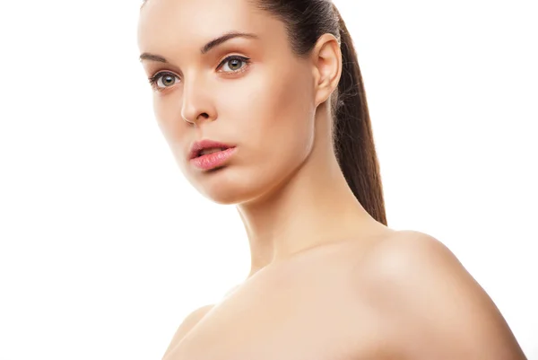 Beautiful woman's face with clean skin on white — Stock Photo, Image