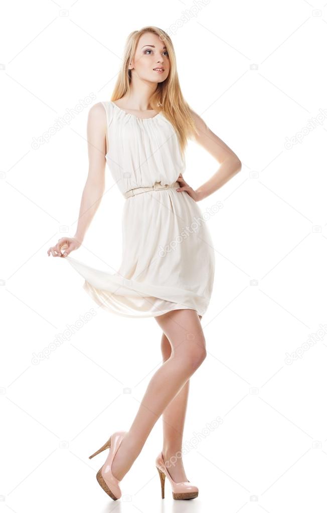 Posing blond woman with long hair on white