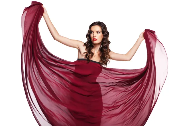 Mulher de vestido vermelho voando no vento isolado — Fotografia de Stock