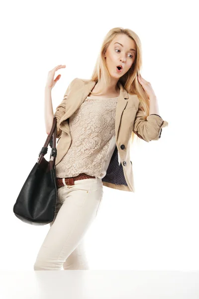 Young excited woman looking at the shop window — Stock Photo, Image