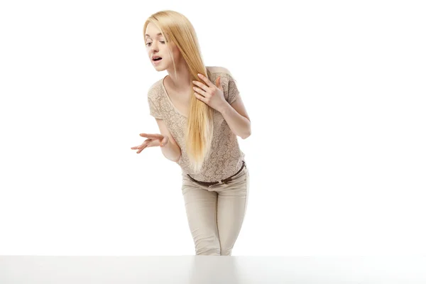 Young excited woman looking at the shop window — Stock Photo, Image