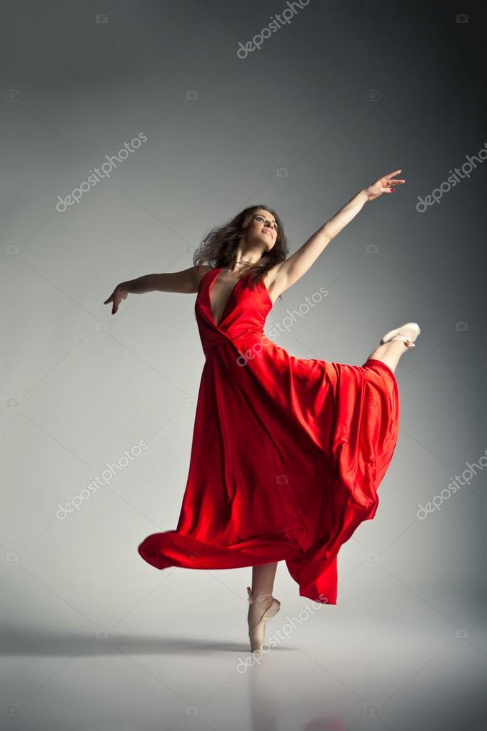 Ballet dancer wearing red dress over grey Stock Photo by ©Julenochek ...