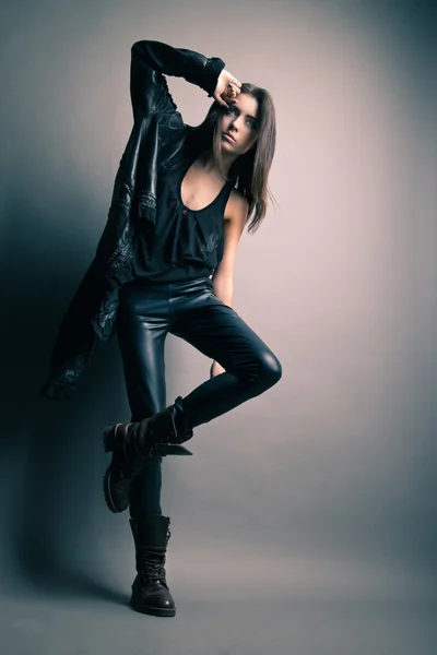 Fashion model wearing leather pants and jacket — Stock Photo, Image