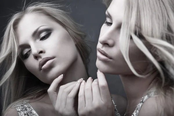 Beautiful sexy young woman near mirror over white — Stock Photo, Image