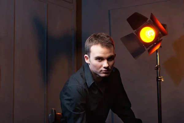 Closeup portrait of man in studio with flashes — Stock Photo, Image