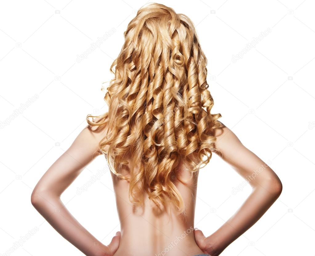 Rear view of woman with curly long blond hair