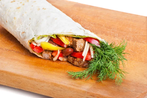Beef burrito with peppers, onion and tomato Stock Picture