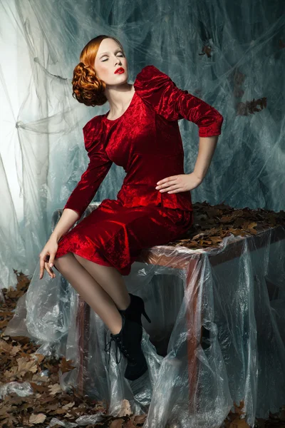 Beautiful woman against autumn decoration. Fashion — Stock Photo, Image
