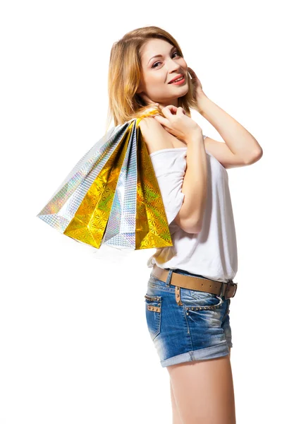 Heureuse femme souriante avec des sacs à provisions isolés — Photo