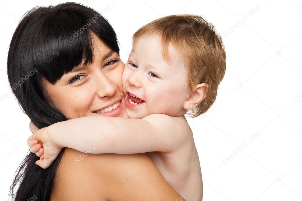 Mother with her baby after bathing in white towel