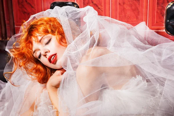 Sleeping Woman in white wedding dress. Bathroom — Stock Photo, Image