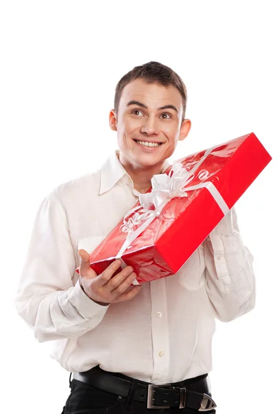 Smiling man holding gift isolated on white — Stock Photo, Image