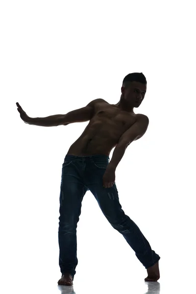 Izole bir genç adam dansçı silüeti — Stok fotoğraf
