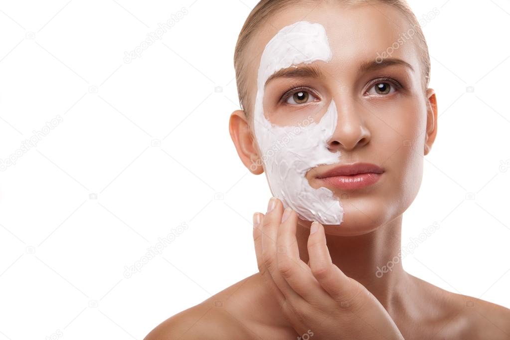 Woman with spa mask on her face isolated