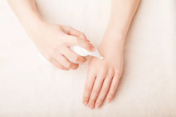 Woman applying cream. Skin care concept. Manicure — Stock Photo, Image