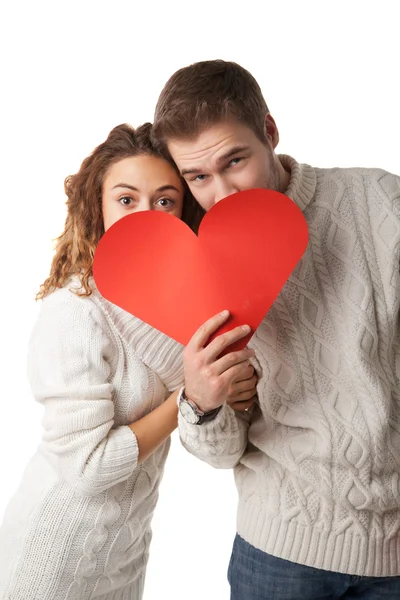 Par hålla ett rött hjärta — Stockfoto