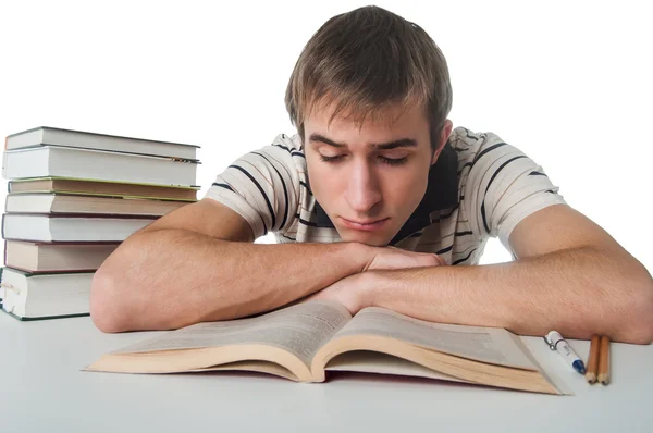 Estudante com pilha de livros — Fotografia de Stock