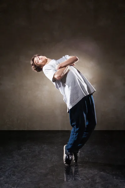 Urban hip hop dancer over grunge concrete wall — Stock Photo, Image