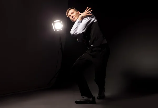 Modern style dancer dancing on dark background — Stock Photo, Image