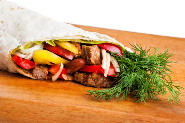 Beef burrito with peppers, onion and tomato — Stock Photo, Image