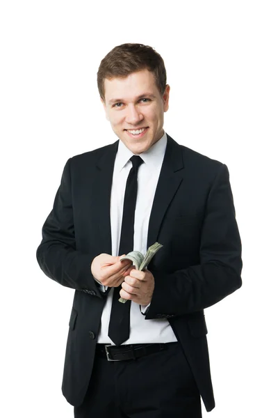 Young businessman holding money — Stock Photo, Image