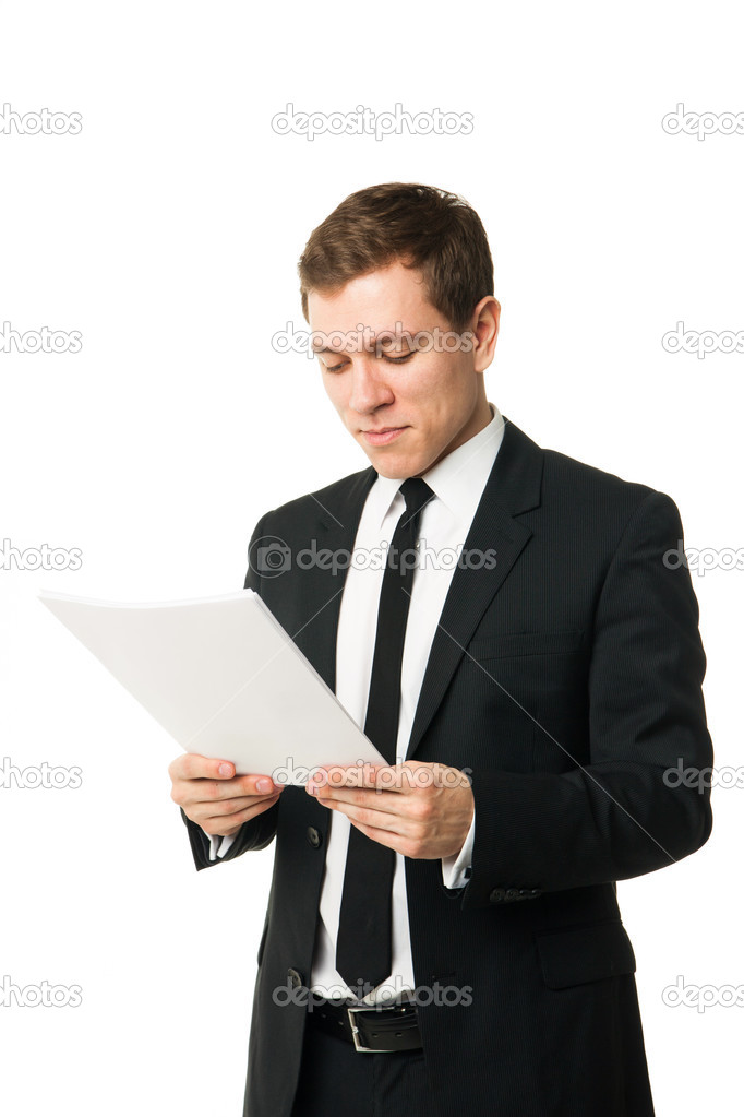 Businessman reading papers from work isolated