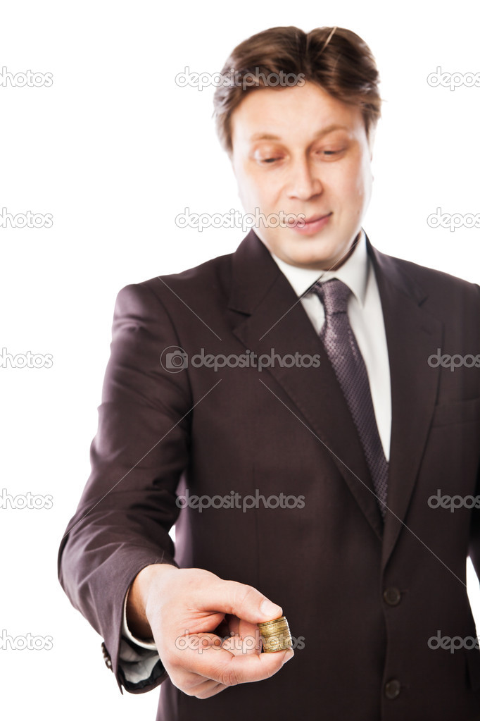 Businessman holding coins in his hand isolated