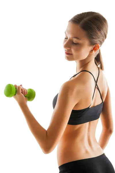 Back of young fit woman holding dumbbells on white — Stock Photo, Image