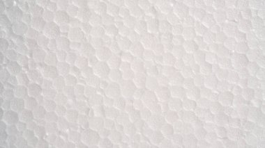 Beyaz köpük kaplama üst görünüm. Küçük ve büyük köpük boncuklar, polistiren çarşaf yüzeyi yakın plan, dikişsiz arka plan