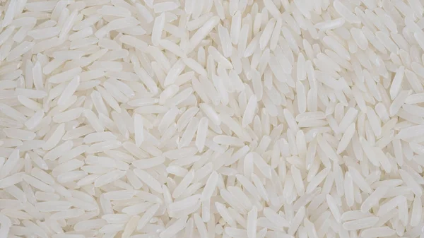 Organic White Raw Jasmine Basmati Rice Background White Long Seeds — Stok fotoğraf