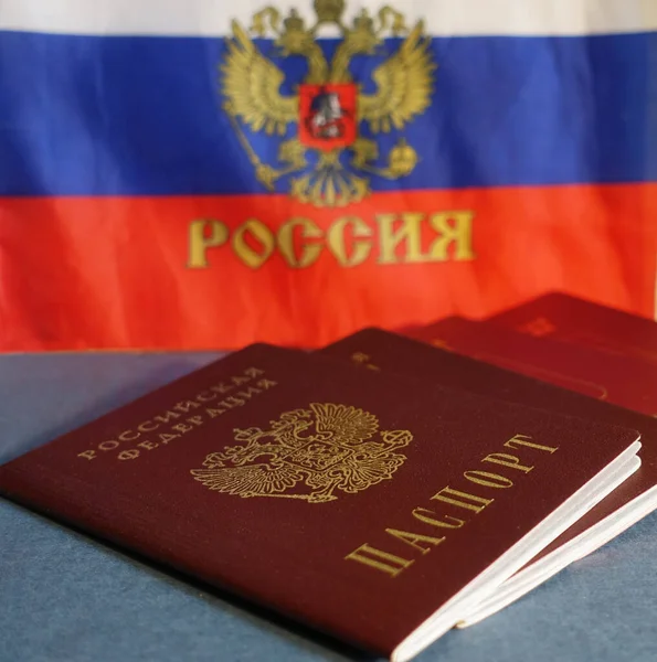 Passports of the Russian Federation lying on the background of the Russian flag