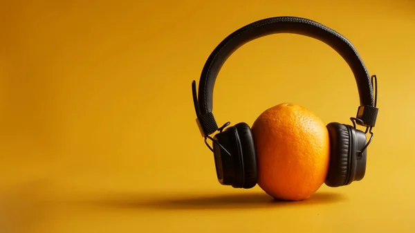 Black Wireless Headphones Fresh Orange Bright Orange Background Concept Musical — Stock Photo, Image