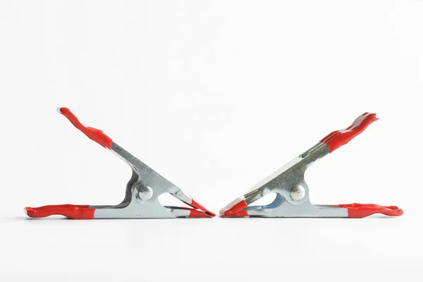 Red Metal Spring Clamps White Background Selective Focusing Free Space — Stock Photo, Image