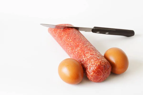 Smoked Sausage Chicken Eggs Sharp Knife White Background Concept Metaphor — Foto de Stock