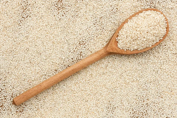 Wooden spoon with sesame seeds — Stock Photo, Image