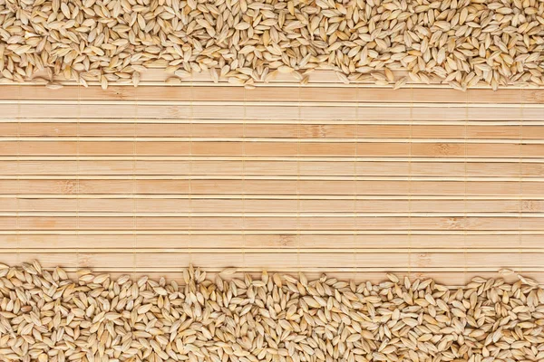 Barley on a bamboo mat — Stock Photo, Image