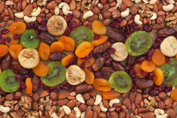 Nuts and dried fruits are on burlap — Stockfoto