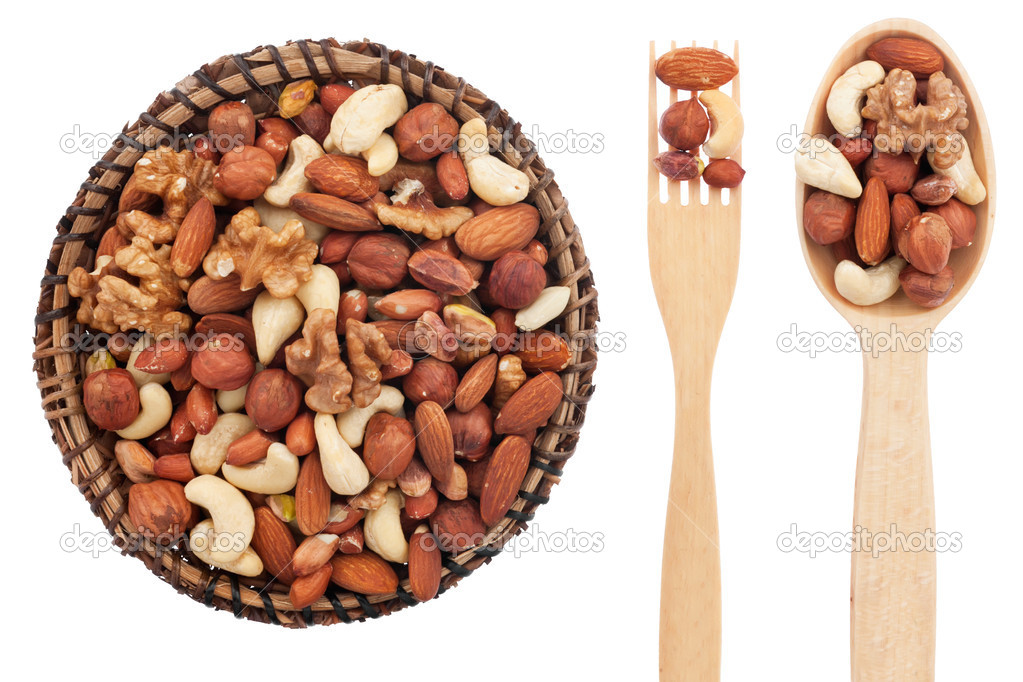 Spoon, a fork, a plate with nuts