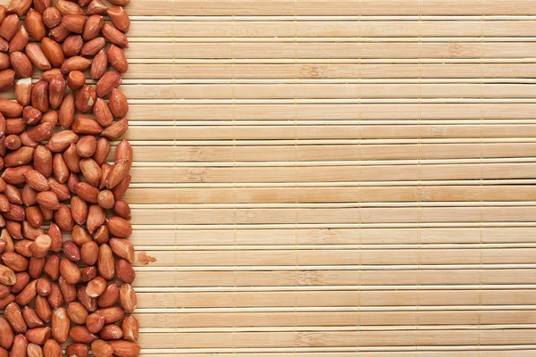 Peanut is on a bamboo mat — Stock Photo, Image