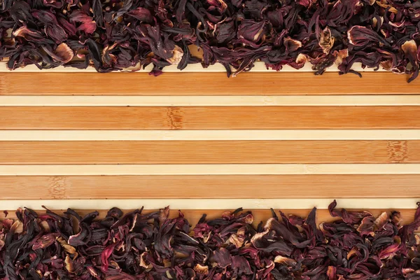 Dried hibiscus on a bamboo mat — Stock Photo, Image