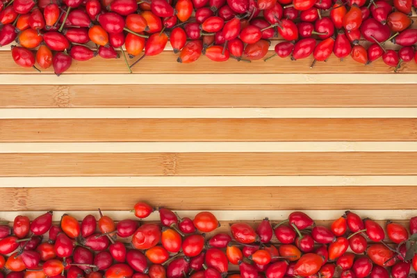 Rosehip on a bamboo mat — Stock Photo, Image