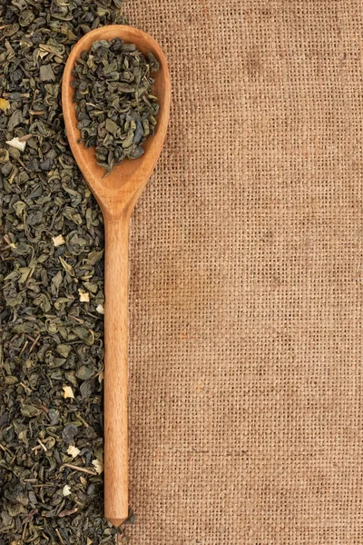 Spoon with green tea — Stock Photo, Image