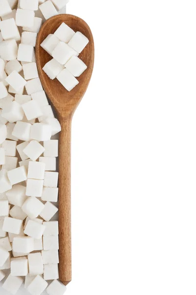 Wooden spoon with lump sugar — Stock Photo, Image